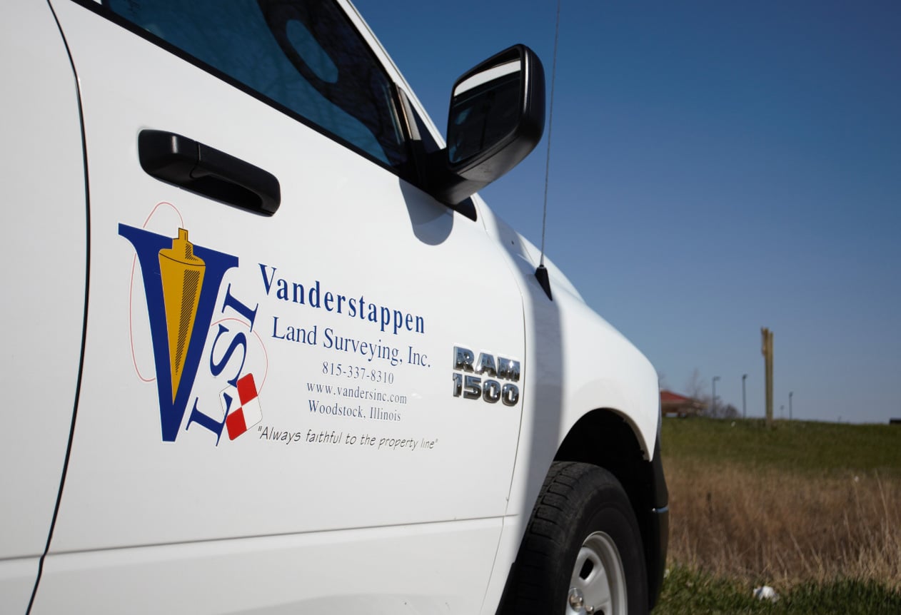 White pickup truck close-up on the Vanderstappen logo